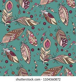 Seamless pattern with colored purple and blue feathers in vector ornament
