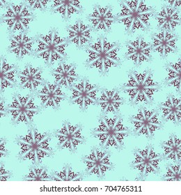 Seamless pattern. Colored snowflakes in random order. Blue-green and brown.