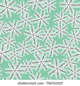Seamless pattern. Colored snowflakes in random order. Green, gray, white.