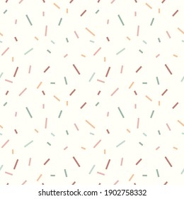 Seamless pattern with colored sprinkles on a white background. Geometric modern print. Great for fabric, wallpaper, textile, wrapping. Vector illustration.