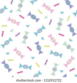 Seamless pattern from colored sweets on a white background.