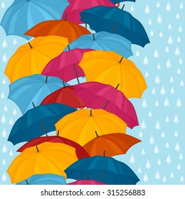Seamless pattern with colored umbrellas for background design.