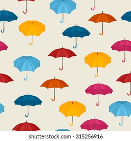 Seamless pattern with colored umbrellas for background design.