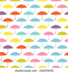 Seamless pattern with colored umbrellas on a white background.