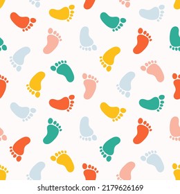 Seamless pattern with colorful baby footprints.