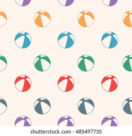 Seamless pattern with colorful beach balls on beige background. Baby pattern.