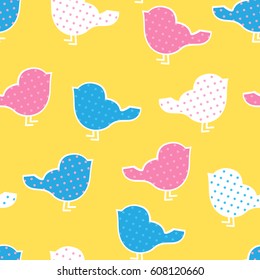 Seamless pattern with colorful birds silhouettes on yellow backg