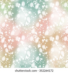 Seamless pattern with colorful blurred background and realistic snow overlay.  Background tile for winter holidays. Abstract texture template.