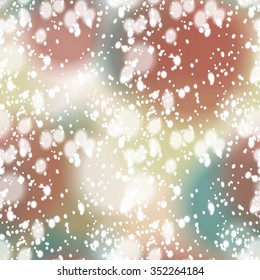 Seamless pattern with colorful blurred background and realistic snow overlay.  Background tile for winter holidays. Abstract texture template.