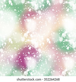 Seamless pattern with colorful blurred background and realistic snow overlay.  Background tile for winter holidays. Abstract texture template.