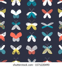 Seamless pattern with colorful
butterflies. Symmetric insects, dark background, straight rows. Hand drawn illustration. Yellow, blue, orange, white wings. Decorative elements. Doodle style moths