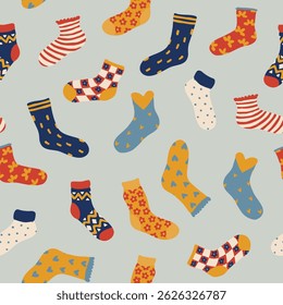 Seamless pattern with colorful cartoon socks in various styles on light background.