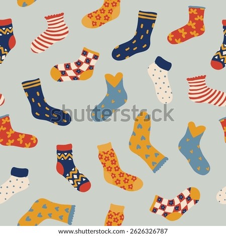 Seamless pattern with colorful cartoon socks in various styles on light background.