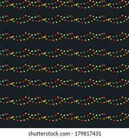 Seamless pattern with colorful childish light bulb garland on dark blue background. Hand drawn doodle texture.