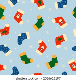 Seamless pattern of colorful Christmas socks and snowflakes. Doodle style. Christmas winter background. Vector illustration