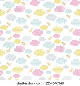 Seamless pattern of colorful clouds with flying happy birds wearing pink heals. Great for textile print, party invitations or packaging. Vector file. 