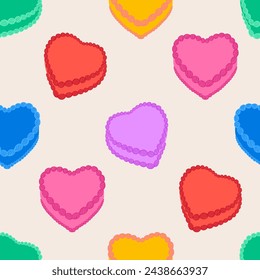 Seamless pattern with colorful cute heart shaped cakes. Funky vector flat background in kid core aesthetic