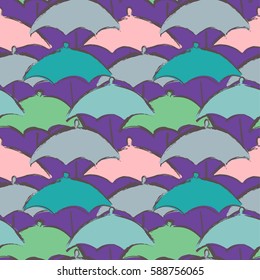Seamless pattern with colorful cute umbrellas painted with watercolor grunge brushes. Vector illustration 