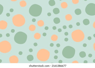 Seamless pattern with colorful dots on light green background. Can be used for fabric,fashion,cloth,textile,wrapping,covers,decor.