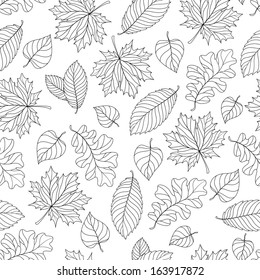 Seamless pattern with colorful fall leaves on a natural background