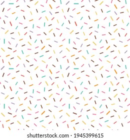 Seamless pattern with colorful fancy sprinkles on white. Edible sweet topping on repeating background for wallpapers, prints, textiles and fabric design.