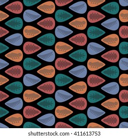 Seamless pattern with colorful guitar picks mediators on black background