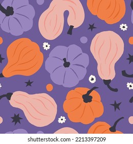 Seamless pattern of colorful hand drawn pumpkins on purple background. Creative prints surface design. Playful graphic flat illustration for seasonal fall, autumn and Halloween holiday.