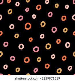 Seamless pattern with colorful hand drawn rings and black background