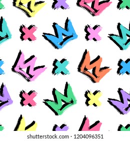 Seamless pattern with colorful hand-drawn crowns and crosses isolated on white background. Rough brush painted shapes vector backdrop. Cute doodle style illustration. 