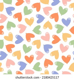 Seamless pattern with colorful heart shaped balloons.