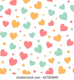 Seamless pattern with colorful hearts and dots on a white background. Vector repeating texture.