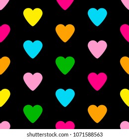 Seamless pattern from the colorful hearts on the black background. Vector illustration