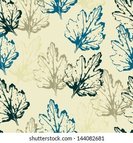 Seamless pattern with colorful leaves on a light background