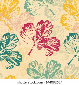 Seamless pattern with colorful leaves on a warm background