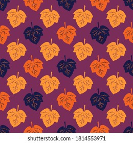 Seamless pattern from colorful leaves on a burgundy background. Autumn leaf fall. Vector illustration for creative design, decoration of banners, cards, prints, textiles, fabric, wallpaper, packaging.