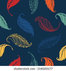 Seamless pattern of colorful leaves on a blue background