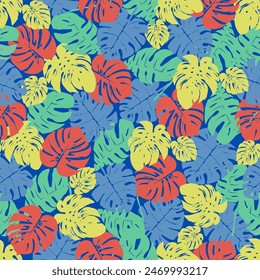 Seamless pattern of colorful leaves on dark blue background. Presented through the close positioning of leaves together as one wall. This format is suitable for printing on fabric, textiles and paper.