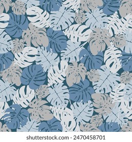 Seamless pattern of colorful leaves on a dark blue background. Presented through the close positioning of leaves together as one wall. This format is suitable for printing on fabric, textile and paper
