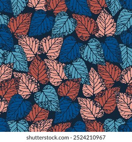 Seamless pattern of colorful leaves on dark blue background. Presented through the arrangement of leaves close together to form a single wall. The pattern is ideal for printing on fabric and textile.