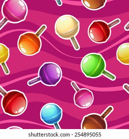 Seamless pattern with colorful lollipops on pink background