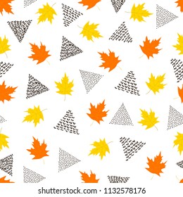 Seamless pattern with colorful maple leaves and black triangles on the white background . Vector illustration