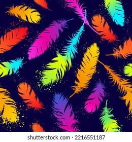 Seamless pattern with colorful neon feathers. Background in grunge style with bright splashes of paint. Modern template for textiles and fabrics. Vector illustration.