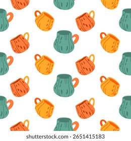 Seamless pattern with colorful orange, yellow, and green mugs in flat autumn style on white background. For fall designs, fabric prints, wrapping paper, kitchen textiles, packaging, and scrapbooking.