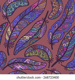 Seamless pattern of colorful ornamental bird feathers in a random arrangement and square format suitable for wallpaper textile or tiles vector illustration