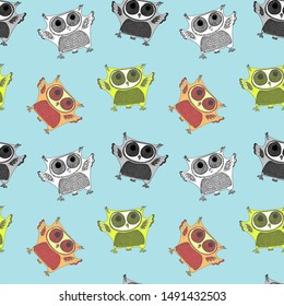 Seamless pattern with colorful owls. four birds on blue backgraund