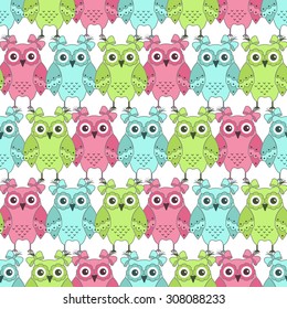 Seamless pattern of colorful owls on a white background