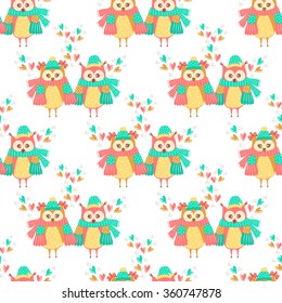 Seamless pattern of colorful owls on a white background