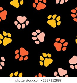 Seamless pattern with colorful paws and black background