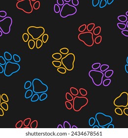 Seamless pattern with colorful paws and black background
