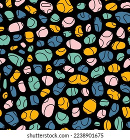 Seamless pattern with colorful pebbles and black background